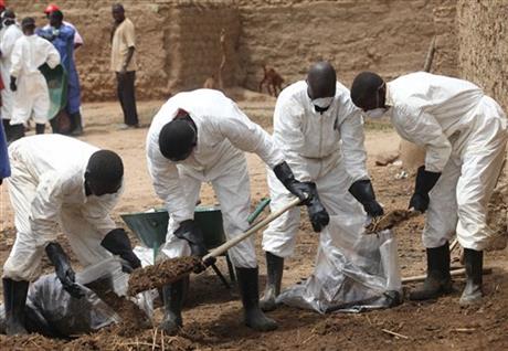Workers remove lead-contaminated soil from a similar incident in Nigeria in 2010.  Photo: AP.
